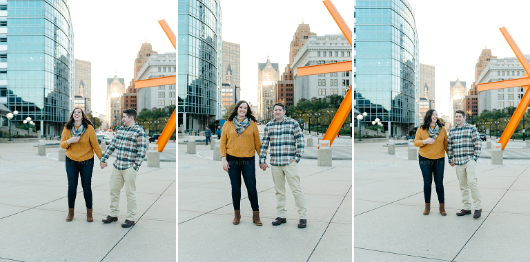 a couple gets goofy with each other in downtown Milwaukee during their milwaukee engagement photos